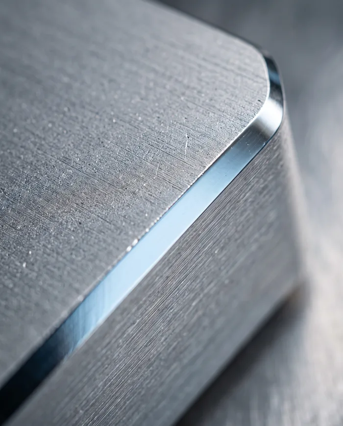 Macro of brushed aluminum with a polished chamfer